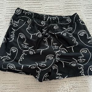 ASOS medium abstract face swim trunks